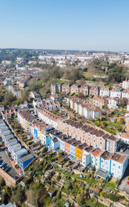 Drone image looking over bridge to the suspension bridge.
