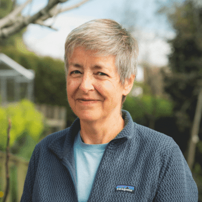 Close portrait of Sue in her garden.