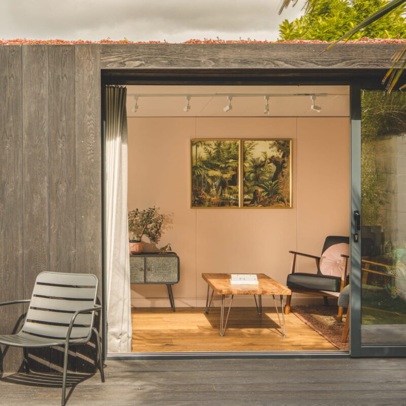 Doors open of the Little Green Room in burnt cedar