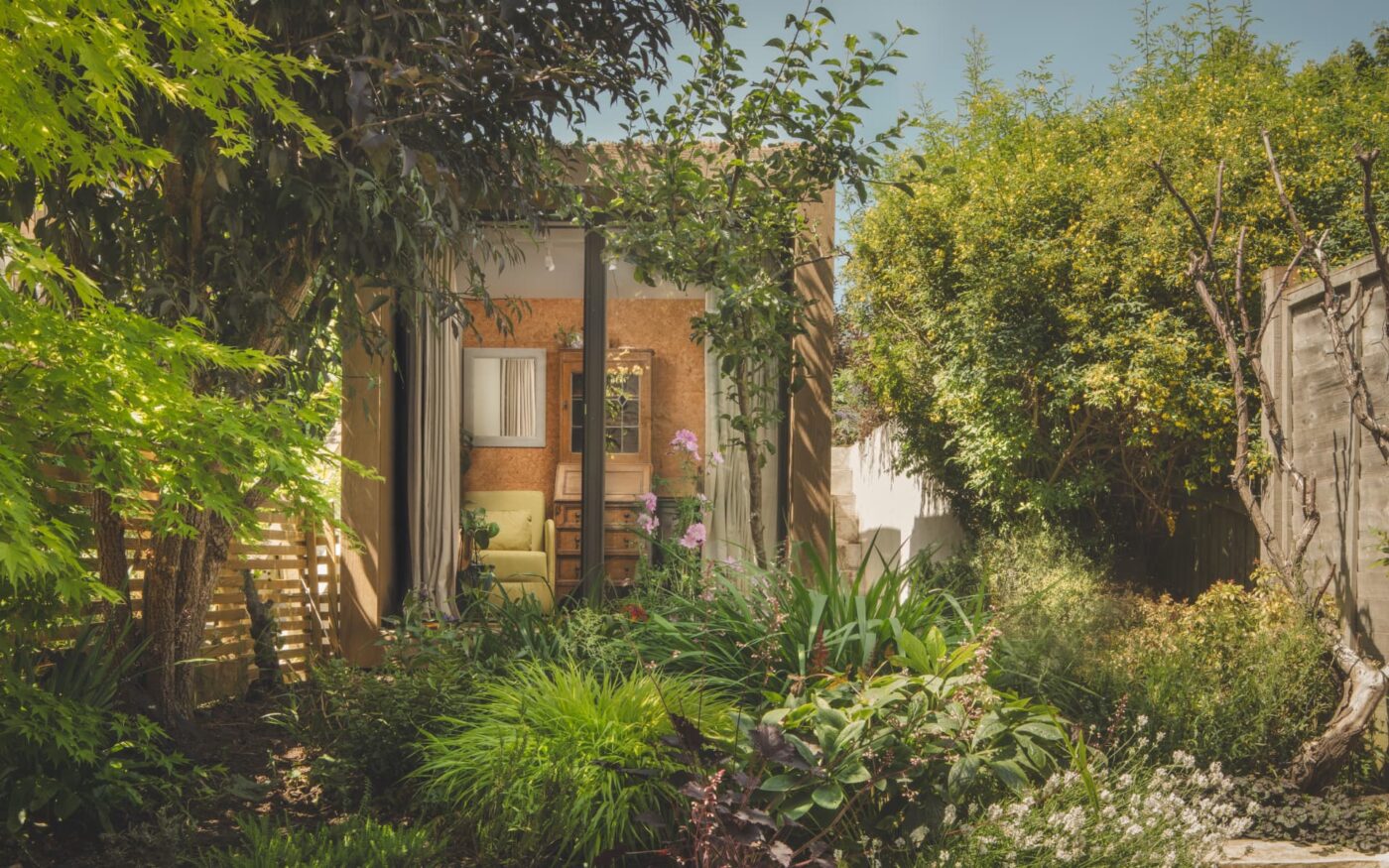 Little Green Room surrounded by trees and plants