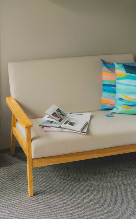 Delyth's studio chair with books on top.