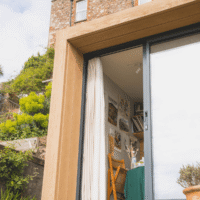 Exterior of Little Green Room with the sliding doors open.