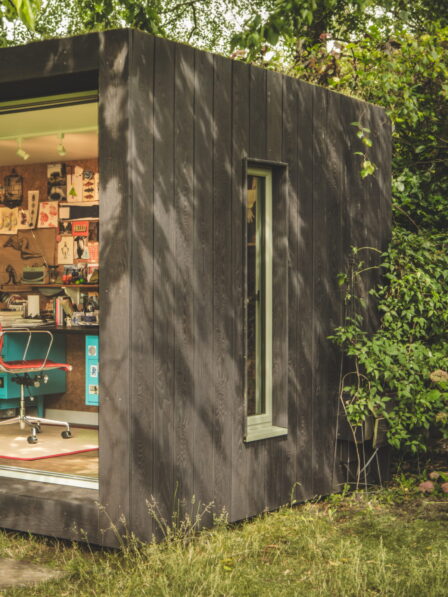 Exterior of Little Green Room in burnt cedar.