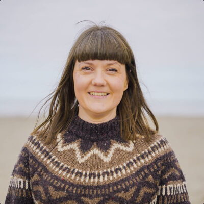 Close portrait of Delyth on the beach.