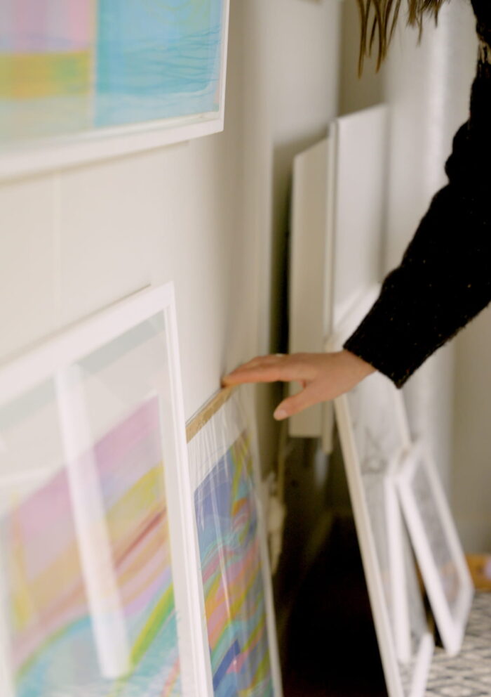 Delyth flicking through artwork in her Little Green Room.
