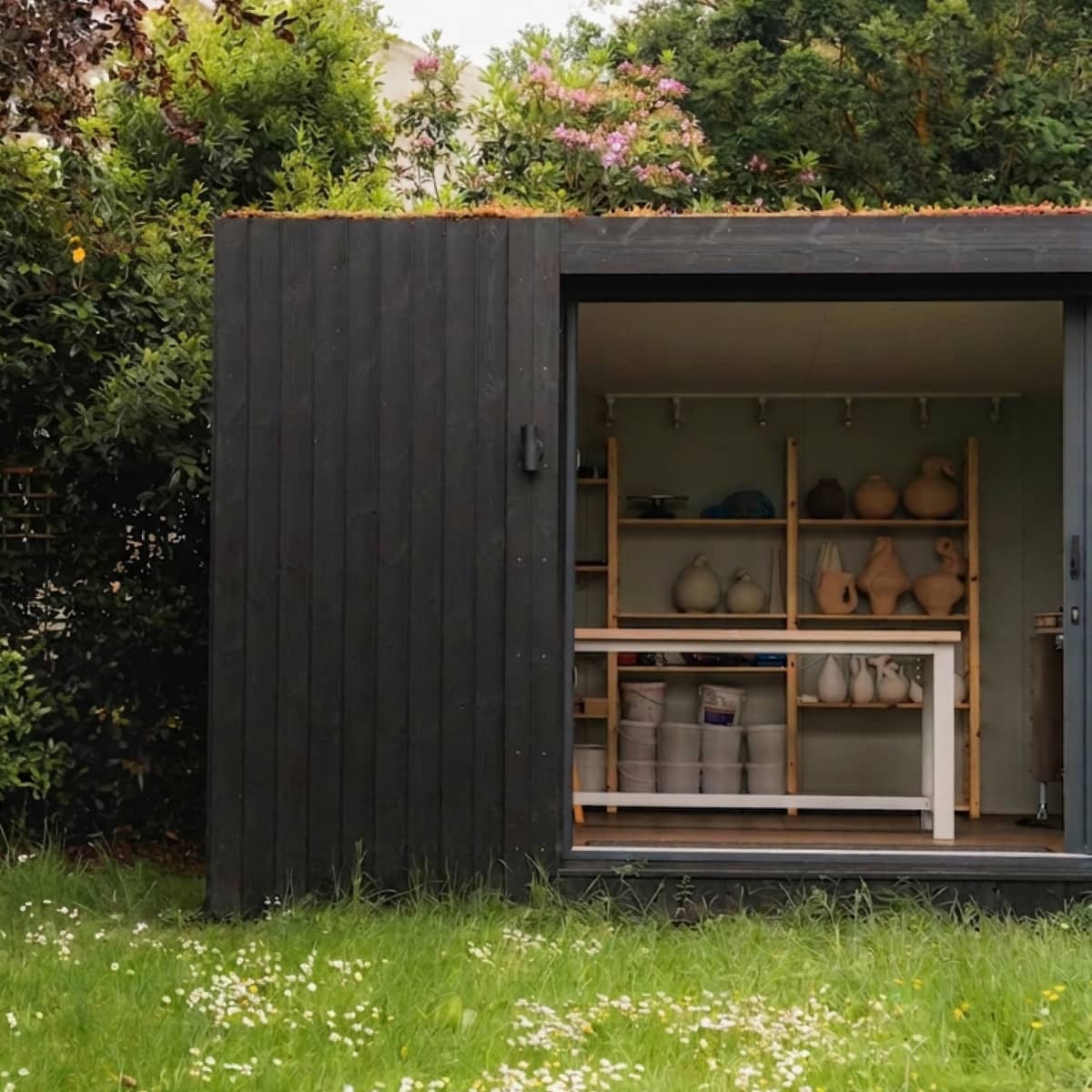 Little Green Room doors open in burnt cedar