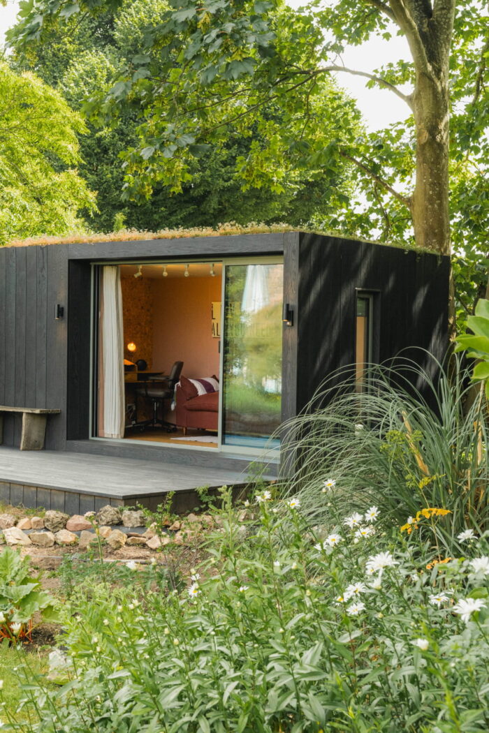 Little Green Room surrounded by greenery.