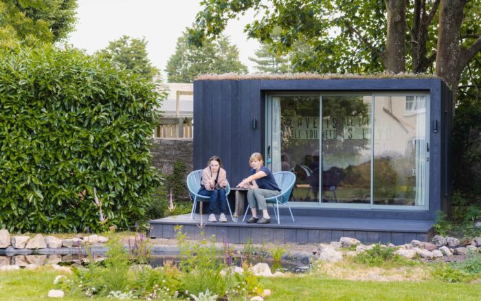 Relaxing on the Little Green Room decking next to the pond